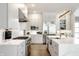Bright kitchen showcasing stainless steel appliances, a large island, and sleek cabinetry with natural wood accents at 340 Beechwood Farm Ln, Indianapolis, IN 46260