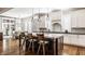 Well-appointed kitchen with a view to the outdoor patio, elegant finishes and eat-in island at 340 Beechwood Farm Ln, Indianapolis, IN 46260