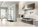 Modern kitchen design highlighting stainless steel appliances, a marble countertop island, and an adjacent dining area at 340 Beechwood Farm Ln, Indianapolis, IN 46260