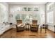 Inviting living room featuring hardwood floors, plantation shutters, and comfortable seating at 340 Beechwood Farm Ln, Indianapolis, IN 46260