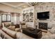 Spacious living room showcasing a stone fireplace, custom built-ins, and stylish decor at 340 Beechwood Farm Ln, Indianapolis, IN 46260