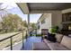 Relaxing covered patio features comfortable seating with a view of the manicured yard at 340 Beechwood Farm Ln, Indianapolis, IN 46260
