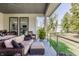 Covered outdoor patio features comfortable furniture and overlooks a beautifully landscaped yard at 340 Beechwood Farm Ln, Indianapolis, IN 46260