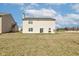 Spacious backyard featuring vinyl siding and well-maintained grassy area at 11851 Fawn Crest Dr, Indianapolis, IN 46235
