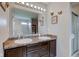 Bathroom featuring double sinks, a large mirror, vanity, and a walk-in shower at 11851 Fawn Crest Dr, Indianapolis, IN 46235