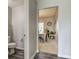 Bathroom with view of dining area, toilet and neutral colors at 11851 Fawn Crest Dr, Indianapolis, IN 46235