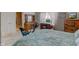This is a spacious bedroom featuring a large dresser, desk, and a king bed at 11851 Fawn Crest Dr, Indianapolis, IN 46235