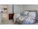 Bedroom with a queen bed, nightstand, and closet with sliding doors at 11851 Fawn Crest Dr, Indianapolis, IN 46235