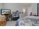 Neutral bedroom with white dresser, TV showing home, and doorway view at 11851 Fawn Crest Dr, Indianapolis, IN 46235