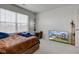 Bedroom featuring a large window and a modern TV at 11851 Fawn Crest Dr, Indianapolis, IN 46235