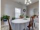 Formal dining room with a chandelier, large table, and views of plants in front of the window at 11851 Fawn Crest Dr, Indianapolis, IN 46235