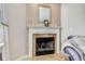 Close up of fireplace with brown tiles, decorative mantle and classic mirror above at 11851 Fawn Crest Dr, Indianapolis, IN 46235