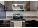 Kitchen featuring stainless steel appliances and dark wood cabinets at 11851 Fawn Crest Dr, Indianapolis, IN 46235