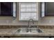 Stainless steel sink with a chrome faucet and dark wood cabinets at 11851 Fawn Crest Dr, Indianapolis, IN 46235