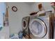 Functional laundry room with modern washer and dryer units at 11851 Fawn Crest Dr, Indianapolis, IN 46235