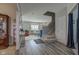 Open-concept living area with wood flooring, ample natural light, and a neutral color palette at 11851 Fawn Crest Dr, Indianapolis, IN 46235