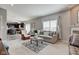 Spacious living room with gray walls, fireplace, and large window providing natural light at 11851 Fawn Crest Dr, Indianapolis, IN 46235