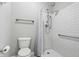 Bright bathroom featuring subway tile shower with glass doors and accessibility bars at 16311 Taconite Dr, Noblesville, IN 46060