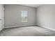 Bright bedroom with a window and plush carpet and white door at 16311 Taconite Dr, Noblesville, IN 46060