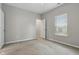 Bright bedroom with a window and plush carpet with a connecting white door at 16311 Taconite Dr, Noblesville, IN 46060