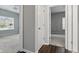 Hallway between carpeted rooms with a view into two bedrooms with natural light at 16311 Taconite Dr, Noblesville, IN 46060