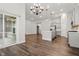 Open layout with kitchen, dining area, and living room features hardwood flooring at 16311 Taconite Dr, Noblesville, IN 46060