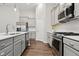Stylish kitchen featuring gray cabinets, stainless appliances and sleek countertops at 16311 Taconite Dr, Noblesville, IN 46060