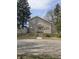 Attractive two-story home with stone exterior, steps leading to the front door, and mature trees at 927 E Southern Ave, Indianapolis, IN 46203
