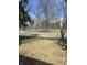 Street view with mature trees and foliage, offering a glimpse of the surrounding neighborhood at 927 E Southern Ave, Indianapolis, IN 46203