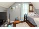 Comfortable bedroom featuring hardwood floors and natural light at 47 Meadow Dr, New Palestine, IN 46163