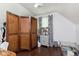 Cozy bedroom with hardwood floors, decorative screen, and ample space for storage at 47 Meadow Dr, New Palestine, IN 46163