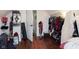 Attic bedroom with wood floors, clothes rack, doorway and creative storage solutions at 47 Meadow Dr, New Palestine, IN 46163