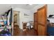Spacious bedroom with hardwood floors, desk, and decorative screen at 47 Meadow Dr, New Palestine, IN 46163