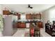 Bright kitchen features stainless steel appliances, wooden cabinets, and an island with seating at 47 Meadow Dr, New Palestine, IN 46163