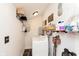 Functional laundry room with a washing machine, shelving, and storage solutions at 47 Meadow Dr, New Palestine, IN 46163