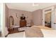 Relaxing bedroom featuring hardwood floors, soft lighting, and a view of the closet at 47 Meadow Dr, New Palestine, IN 46163