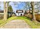 Large backyard with a wooden fence, grassy area, and potential for various outdoor activities at 3634 N Kenwood Ave, Indianapolis, IN 46208