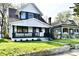 Charming two-story home with a well-maintained lawn and a welcoming front porch at 3634 N Kenwood Ave, Indianapolis, IN 46208