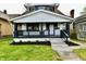 Charming two-story home with a welcoming front porch and meticulously maintained landscaping at 3634 N Kenwood Ave, Indianapolis, IN 46208