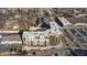 Modern multi-story apartment building stands near shopping centers and features rooftop HVAC units at 1155 S Rangeline Rd # 501, Carmel, IN 46032