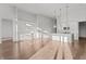 Large kitchen with white cabinetry, island with pendant lights, and modern appliances at 1155 S Rangeline Rd # 501, Carmel, IN 46032
