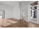 Spacious living area with hardwood floors, opening to a balcony and featuring abundant natural light at 1155 S Rangeline Rd # 501, Carmel, IN 46032