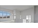 Bright, unfinished living room with a large window and kitchen pass-through at 1155 S Rangeline Rd # 501, Carmel, IN 46032