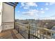 Outdoor balcony overlooking the city with metal railing and wooden floor at 1155 S Rangeline Rd # 506, Carmel, IN 46032