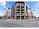 A modern building with balconies and stylish architecture, complemented by streetscape at 1155 S Rangeline Rd # 506, Carmel, IN 46032