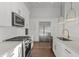 Modern kitchen featuring stainless steel appliances and white cabinets with gold hardware at 1155 S Rangeline Rd # 506, Carmel, IN 46032