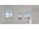 Spacious room with bright, natural light and balcony access, ready for customization at 1155 S Rangeline Rd # 506, Carmel, IN 46032