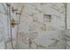 Shower featuring modern fixtures and custom tile work with convenient in-shower niche at 1155 S Rangeline Rd # 506, Carmel, IN 46032