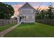 Charming two-story home featuring a well-manicured lawn, front porch, and lovely curb appeal at 2434 N Pennsylvania St, Indianapolis, IN 46205