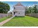 Charming two-story home featuring a well-manicured lawn, front porch, and lovely curb appeal at 2434 N Pennsylvania St, Indianapolis, IN 46205